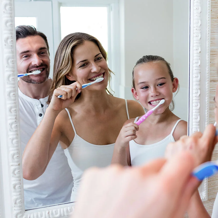 Family brushing teeth after preventative dentistry in Gardena, CA